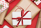 Photo of white and red wrapped holiday present.