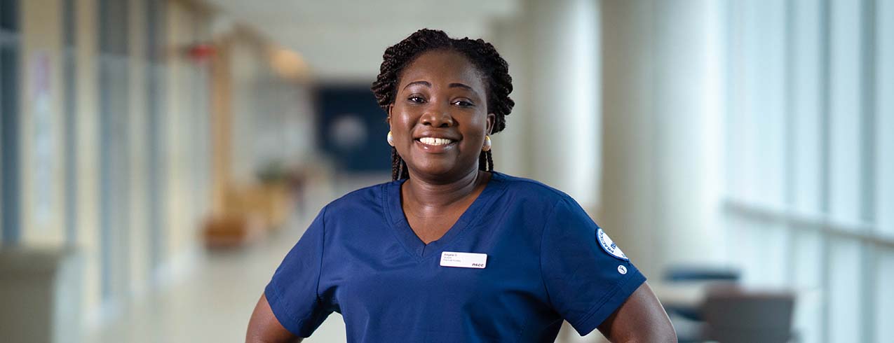 2022-23 NSCC Foundation and Alumni Relations Annual Report cover photo of NSCC student Angela G., in scrubs.