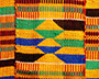 A close-up photo of colourful Kente cloth.