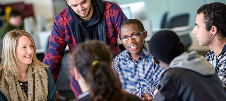 Samuel Kiragu with students