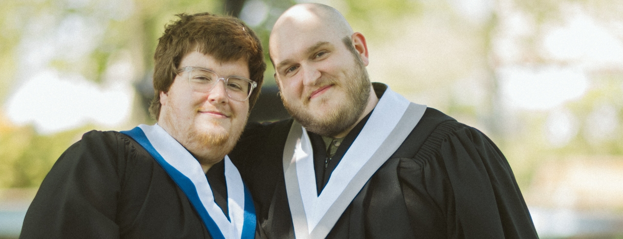2024-25 NSCC Foundation and Alumni Relations Annual Report cover photo of NSCC alum couple Zach and Dustin in their convocation gowns.