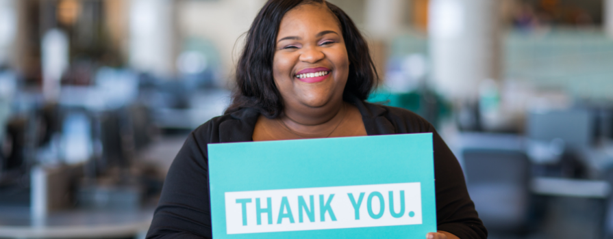 Photo of NSCC student holding a thank you sign.