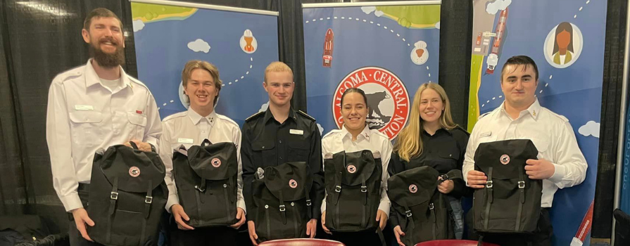 Photo of the 2023 Marine Skills Competition winning team, Fish N Chips. Front Row L-R: Alexis Madore, 1st year Engineering; Kayla Wemp, 3rd year Navigation; Felix Weissbach, 1st year Engineering Back Row L-R: Boyd MacIntrye, 3rd year Engineering; Justin Pautsch, 1st year Navigation; Missing: Pieter Blok, 1st year Navigation