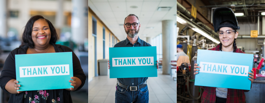 Photo of three NSCC award recipients holding a light blue sign saying "thank you" in white text.