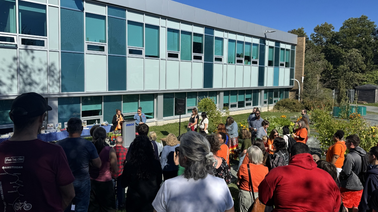 Iga'taqan Opening Ceremony attendees learning about the importance of the garden.