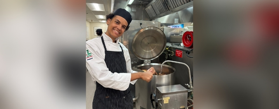Aiden Lawrence working in a kitchen.