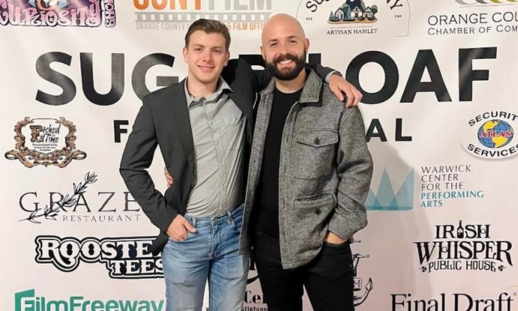 Two men standing on a red carpet Sean MacDougall (Left) and Sean McMullen (right).
