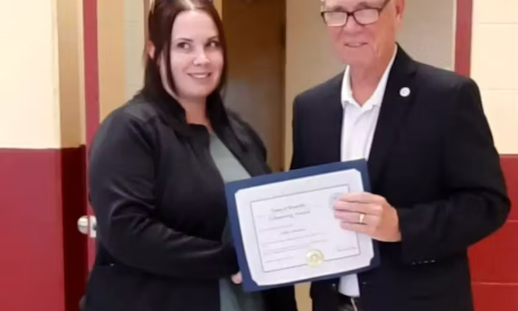 Holly Lawrence (left) was present with an award by the town of Westville for her actions saving a man during the Canada Day Parade by Mayor Lennie White (right).
