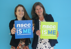Photo of two NSCC alumni holding "NSCC is me" signs