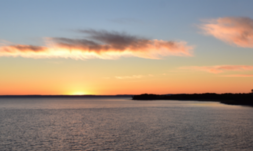 Photo of lake during a sunset