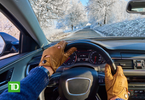 Photo of a driver's arms and hands with a snowy road in the background. The TD Insurance logo is in the bottom left corner.