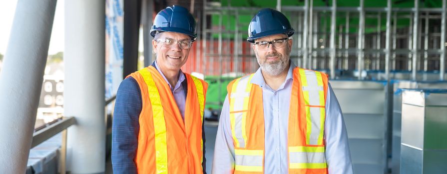 Don Bureaux and Howie Doiron visiting the construction site of the new Sydney Waterfront Campus in Cape Breton.