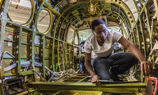 Daniel working on aircraft