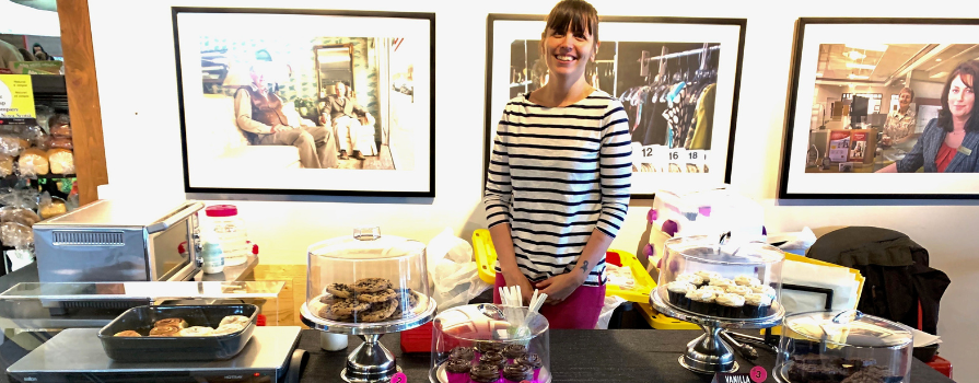 Sydney Daoust at her booth in Alderney Landing Farmer's Market selling baked goods.