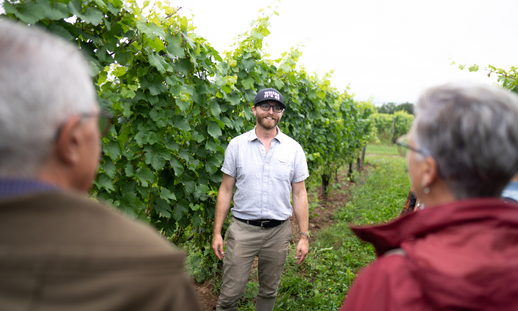 Jeremy Novak giving a tour in vinery.