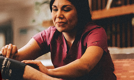 female nursing taking blood pressure.