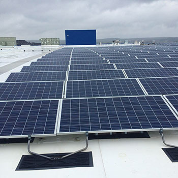 Long line of solar panels on the roof top of the IKEA building.