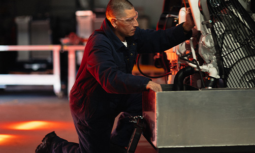 Marine Engineering Navigation student working on an engine