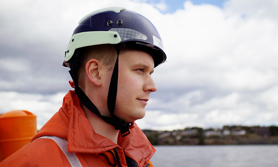 Instructor, Captain Arran Shepherd looking into the distance with the ocean in the background