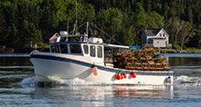 Lobster fishing boat sailing out to sea