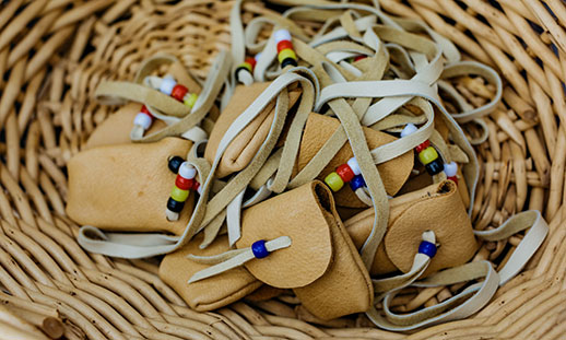 Image of medicine pouches laying in a basket.