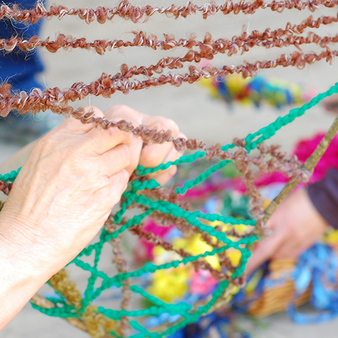 Hands tying rope