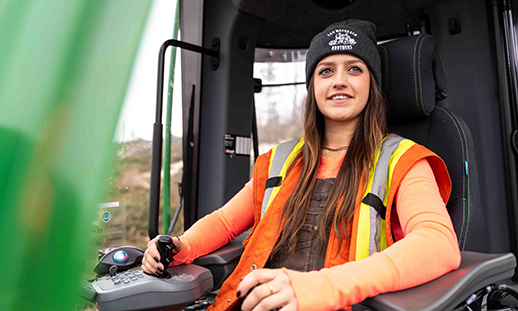 A forest machine operator inside a forwarder