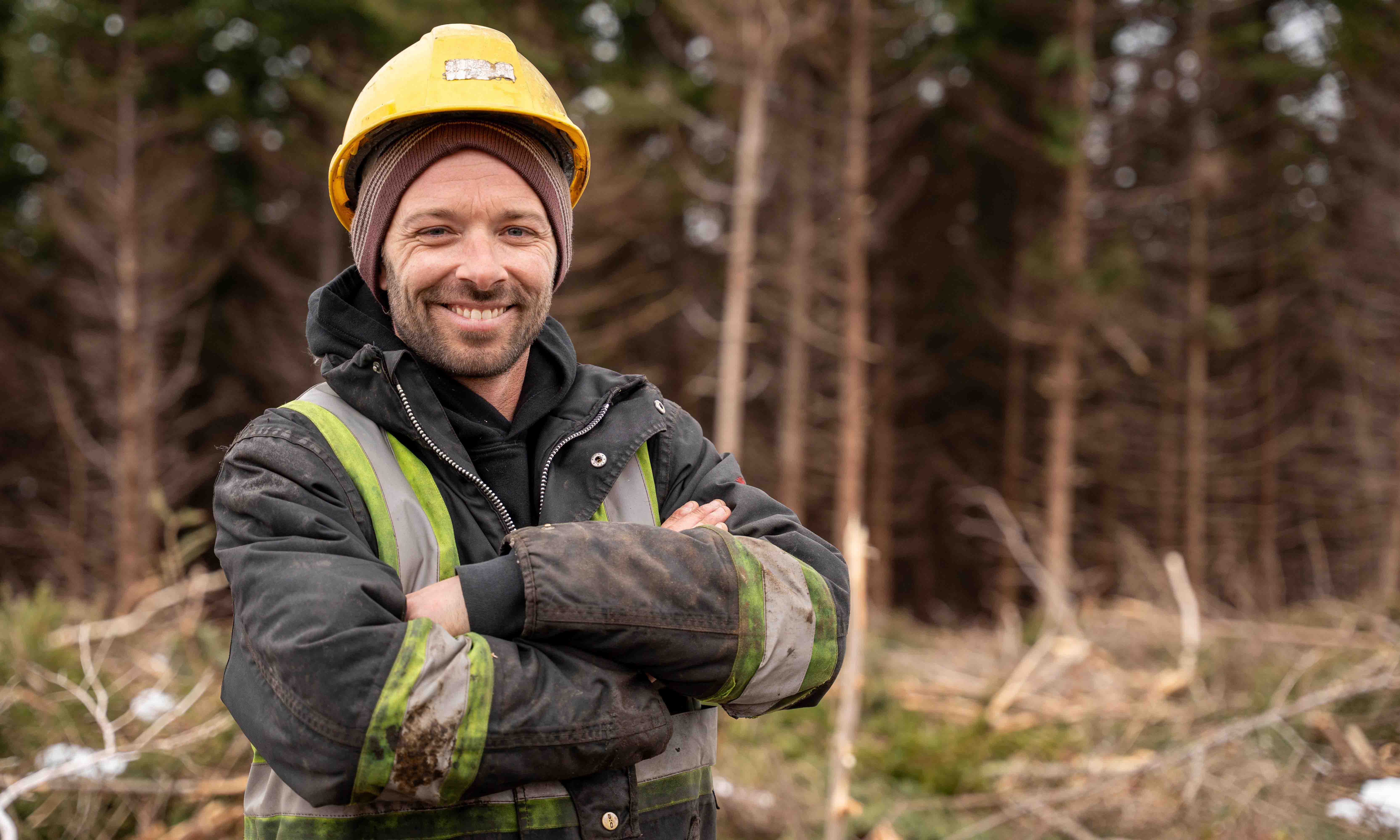 Luke MacGrath wearing a PPE in the woods