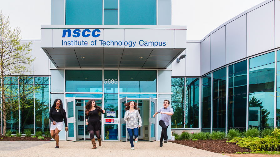 Photo of student walking into NSCC's IT Campus in the winter.