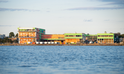 Photo from November 2022 of waterfront view of NSCC's Sydney Waterfront Campus under construction
