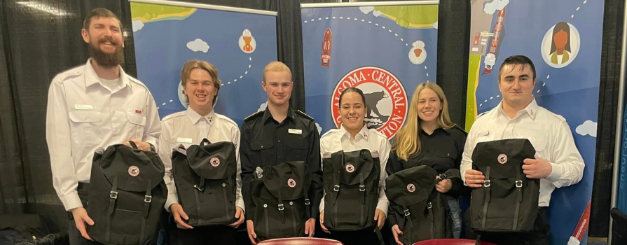 Photo of the 2023 Marine Skills Competition winning team, Fish N Chips. Front Row L-R: Alexis Madore, 1st year Engineering; Kayla Wemp, 3rd year Navigation; Felix Weissbach, 1st year Engineering  Back Row L-R: Boyd MacIntrye, 3rd year Engineering; Justin Pautsch, 1st year Navigation; Missing: Pieter Blok, 1st year Navigation