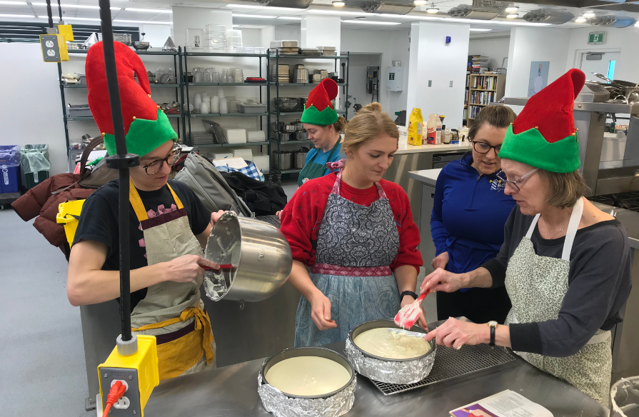 From left to right: Phil, Olivia and Bern Byers making the cheesecakes at NSCC's Kingstec Campus.