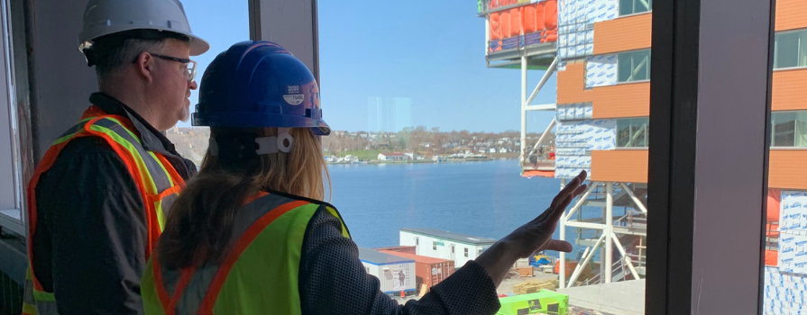 Photo of NSCC Marconi Principal, Carla Arsenault, giving a tour of NSCC's Sydney Waterfront Campus under construction.
