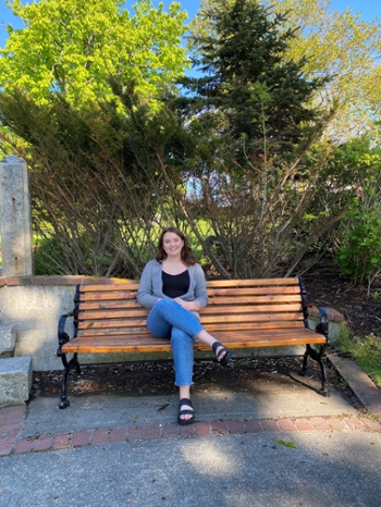 Kirsten sitting on a park bench