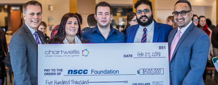 In the photo (L-R): Don Bureaux, President, NSCC; NSCC Student Association Presidents Akash Pandey (Ivany Campus), Krista Holland-Guy (IT Campus) and Mike Pinkney (Truro Campus); and Ashton Sequeira, President at Compass Group, Chartwells’ parent company holding $100,000 cheque