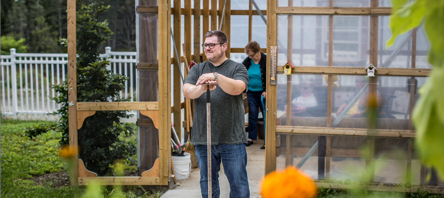 Billy Upton gardening in summer