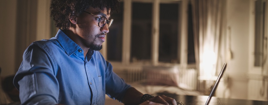 Man sitting at laptop computer