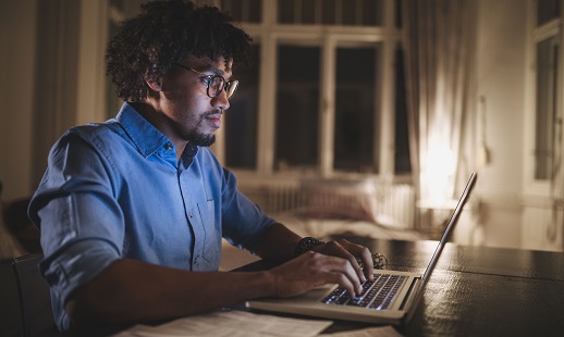 Man sitting at a laptop computer