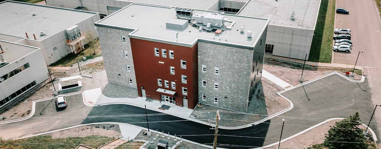 Aerial drone photo of the new Strait Area Residence, captured August 2021.