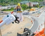 Power line technician student training from an elevated bucket truck at a utility work site.
