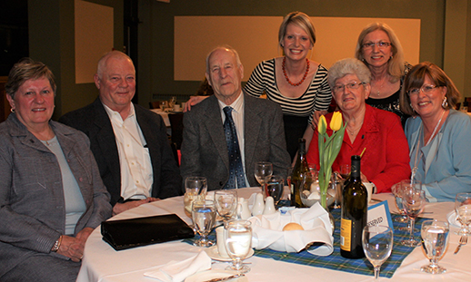 A group of alumni sitting at a table