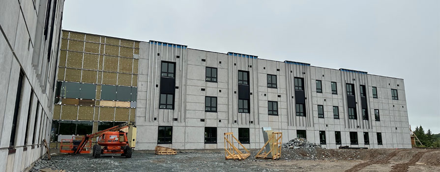 A new building under construction is shown.