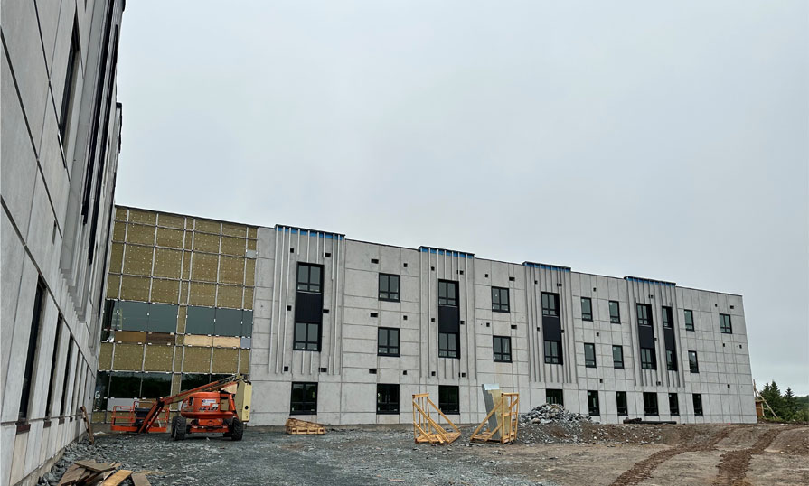 A new building under construction is shown.