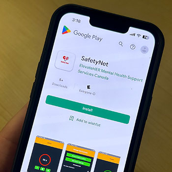 The image shows a phone with the browser open to the Google Play Store and the SafetyNet app available for download.