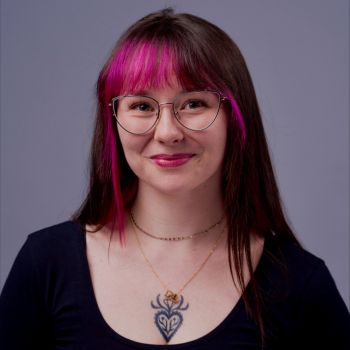 Image of a girl with black and pink hair.