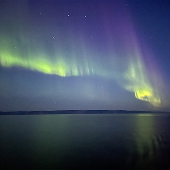 A green and purple display over the Northern Lights.