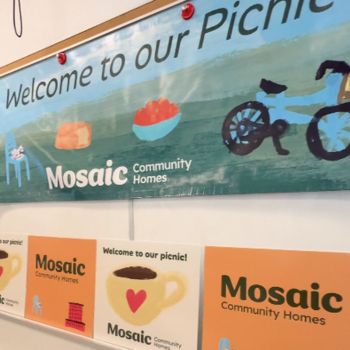 Image shows banners that students produced for Mosaic Community Homes Association.