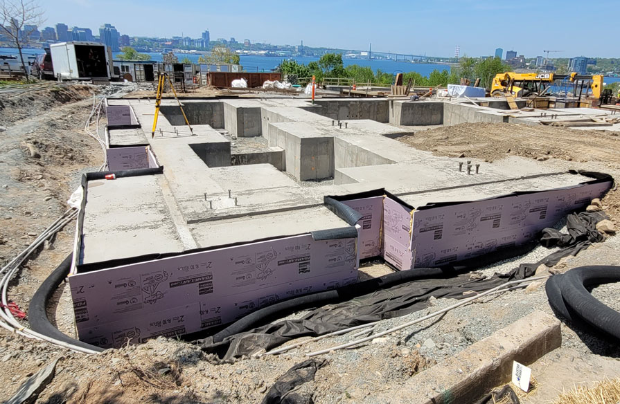 The groundwork at a construction side outdoors is in the process of being built. 