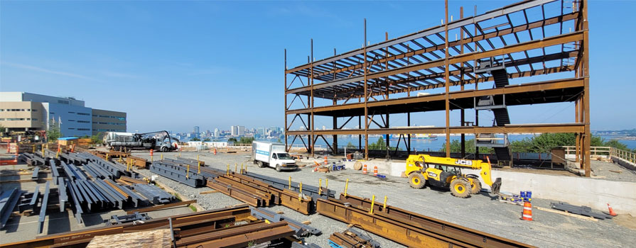A construction site shows the steel structure in place of a new building.