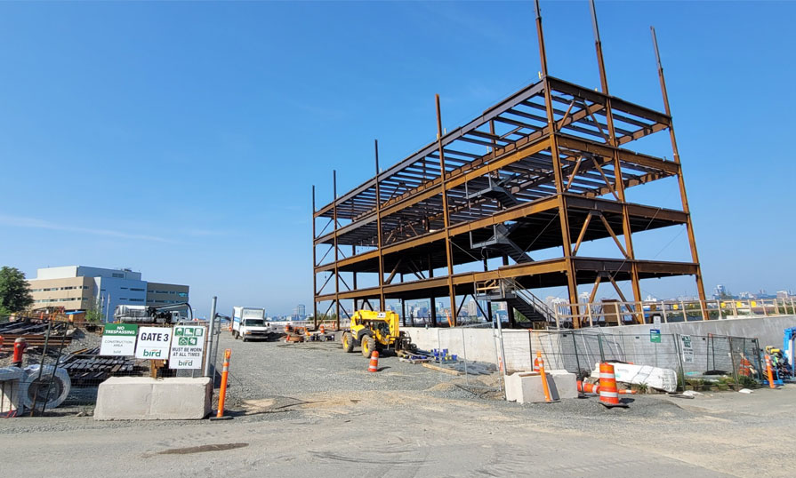 A construction site shows the steel structure in place of a new building.